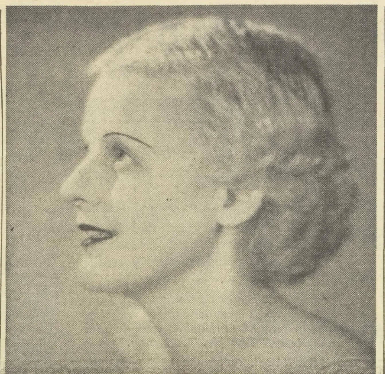 A newspaper studio portrait of a young woman in profile, looking up, her fair hair waved close to her head.